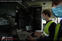 Two persons inside the mobile 5G crafter