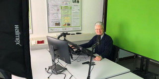 Prof. Wietfeld holding lecture in front of a greenscreen