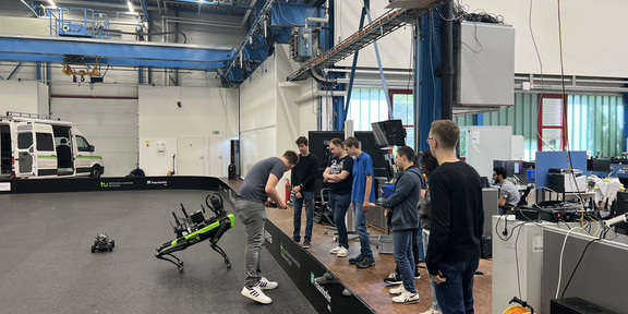 SPOT robot standing in front of people