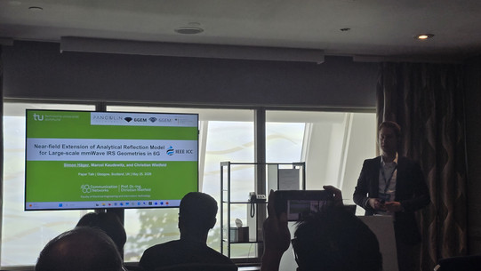 Simon Häger presenting Near-field Extension of Analytical Reflection Model for Large-scale mmWave IRS Geometries in 6G in the Session Holographic MIMO, near field communication