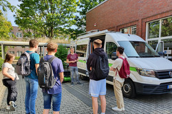 Persons standing in front of the 5G crafter