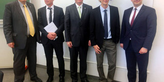 Photo of Stefan Feuerhahn with his doctor hat after his defending