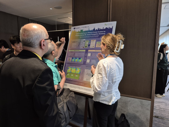 Melina Geis presenting the latest mmWave-IndoorDRaGon results at the IEEE INFOCOM 2026 poster session.