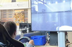 Person steering a vehicle with a video stream